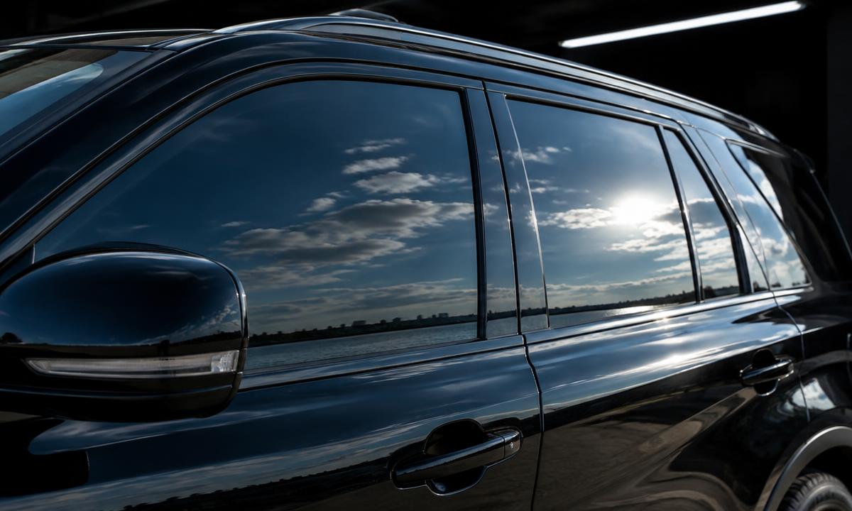 Dark ceramic tint on a black SUV